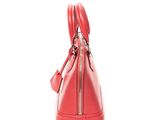 a close up of a red handbag on a white background