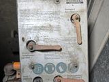 a close up of a metal box with a bunch of screws on it