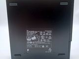 the back side of a black laptop with a white background