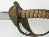 a close up of a sword with a lion head on it