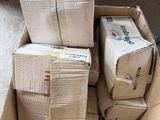 a carton full of boxes sitting on the floor