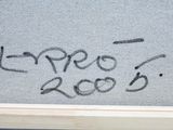 someone wrote this message on the window of a house in the middle of the day