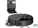 an image of a robotic vacuum cleaner and a laptop on a white background
