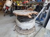 a pile of wires sitting on top of a table in a garage