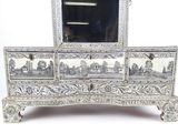 a silver dresser with a mirror on top of it