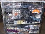 a metal cart with a lot of clothes in it
