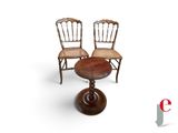 deux chaises et une table sur fond blanc, avec un logo