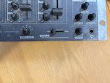 a close up of a control panel on a wooden table