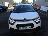 the front of a white citrole parked in a parking lot
