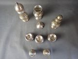 silver plated salt and pepper shakers on a table
