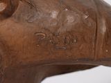 a statue of a bull that is on display