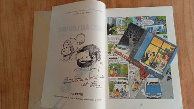 an open book with a picture of a man on it