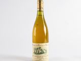 a bottle of wine that is sitting on a table