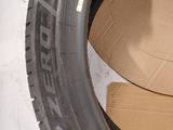 a close up of a tire with a cardboard box inside of it