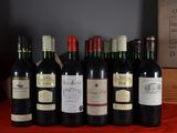several bottles of wine are lined up on a table
