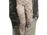 a small statue of a woman sitting on a wall