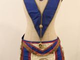 an image of a mannequin with a blue sash and a red sash