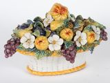 porcelain figurine of a basket of fruit and flowers