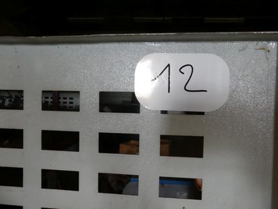 a sign that says 12 12 on the side of a machine