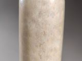 a close up of a vase on a table