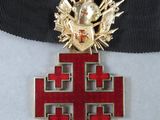 an image of a red cross with a gold eagle on it
