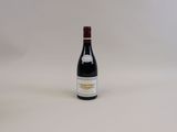 a bottle of wine that is sitting on a table