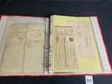 an old document with writing on it sitting on a table