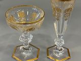 two wine glasses sitting next to each other on a table
