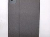 a close up of a gray ipad case on a white surface