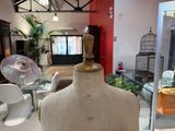 a mannequin on display in a glass case