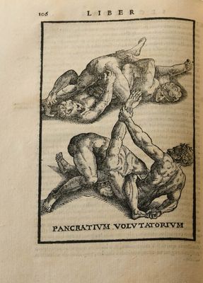 an old book with a drawing of a man wrestling another man