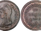 an old coin with a woman ' s head on it