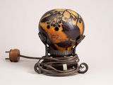 a picture of a globe on a stand with a cord