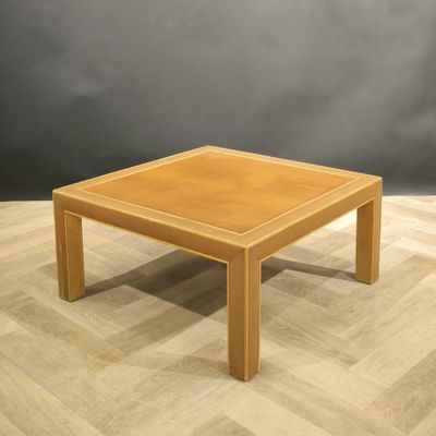 an image of a wooden coffee table on a parquet floor