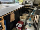 a photo of a kitchen with a lot of cooking equipment