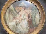 a picture of a woman sitting in a chair with a hat on