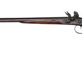 a rifle with a wooden barrel on a white background