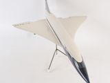 a model of a fighter jet sitting on a stand