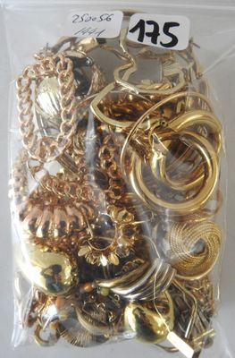 a bag full of gold and silver jewelry on a table