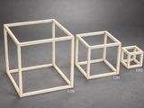 three different sizes of cubes on the table