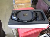 a cd player sitting on top of a red box