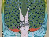 a picture of a woman laying on a bed with a peacock on her back