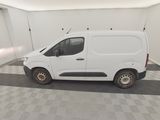 the white van is parked in a clean room with a checkered floor