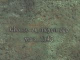 a close up of a plaque on a stone wall