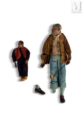 two figurines of a man and a woman standing next to each other