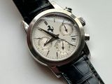 a close up of a wrist watch with a black strap