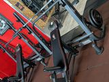a lot of gym equipment on the floor in the room