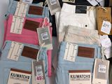 several pairs of men ' s jeans are on display in a store