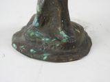 a statue of a woman holding a bird on a pedestal