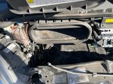 a picture of a car engine with its hood open